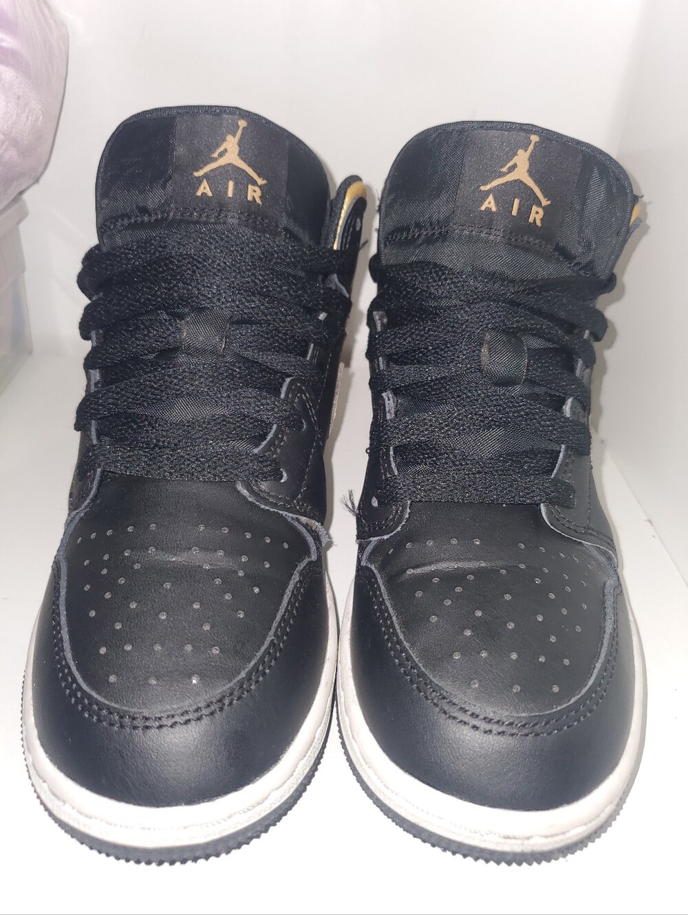 Nike Air Jordan 1 Mid Black/Gold Low-Top Sneakers
